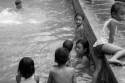 Family taking a bath in the hot springs near Singaraja  